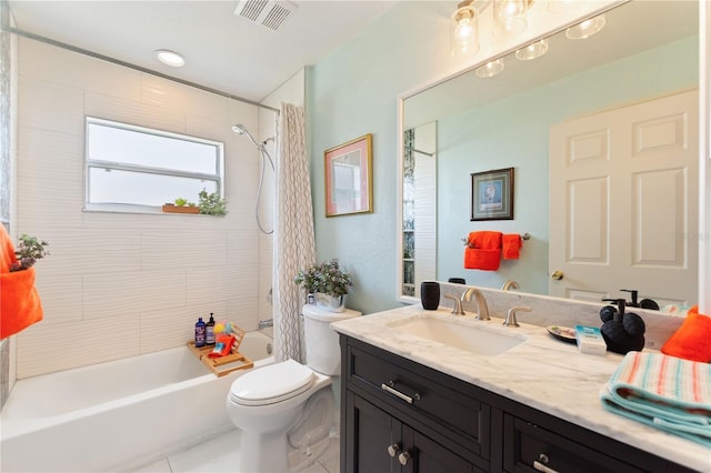 full bathroom with vanity, tiled shower / bath, and toilet