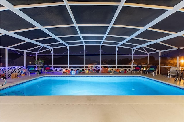 view of swimming pool with a patio area and glass enclosure