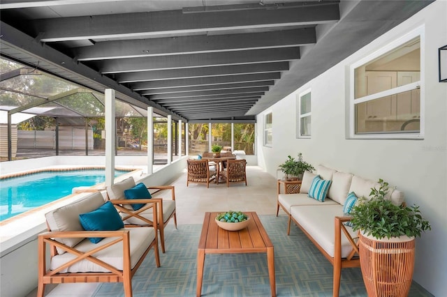 view of swimming pool with outdoor lounge area, a patio, and a lanai