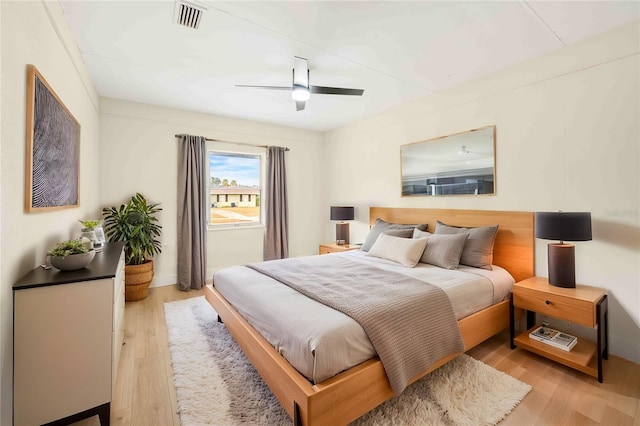 bedroom with ceiling fan and light hardwood / wood-style flooring