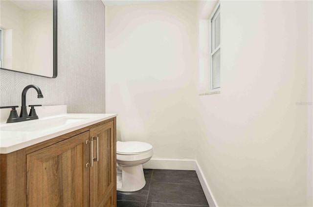 bathroom with vanity, tile patterned floors, and toilet