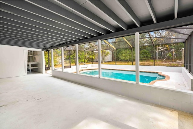 view of pool with a lanai and a patio