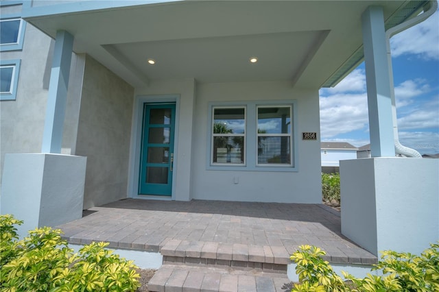 doorway to property with stucco siding