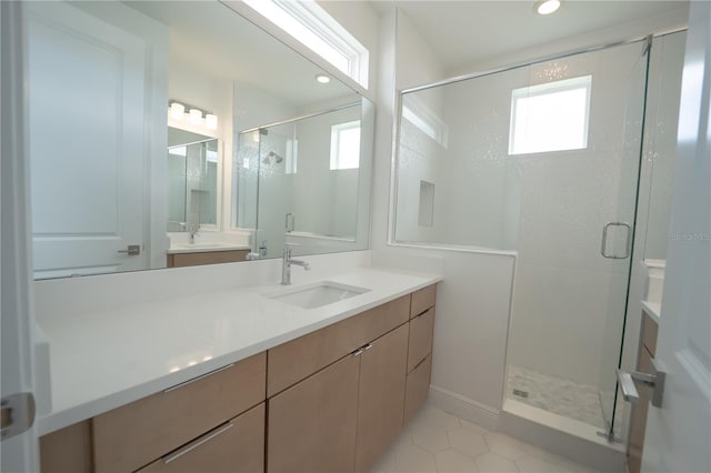 bathroom with tile patterned floors, recessed lighting, a stall shower, and vanity