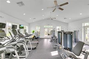 gym featuring lofted ceiling, a ceiling fan, and visible vents