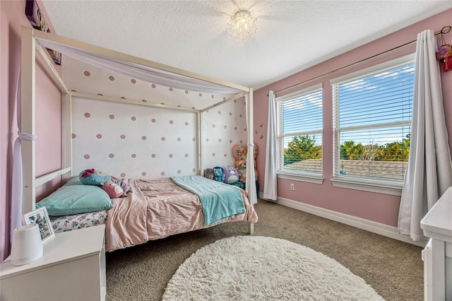 bedroom with carpet flooring and a textured ceiling