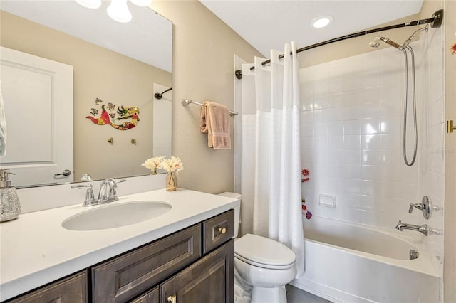 full bathroom with vanity, toilet, and shower / tub combo with curtain