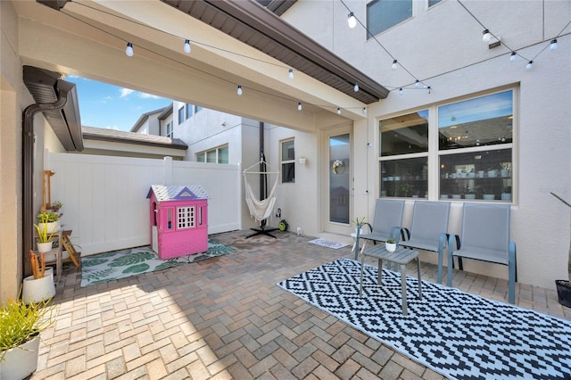 view of patio featuring fence