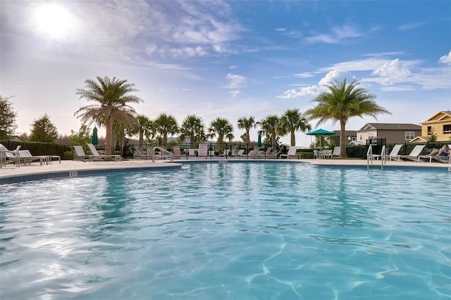 view of swimming pool with a patio