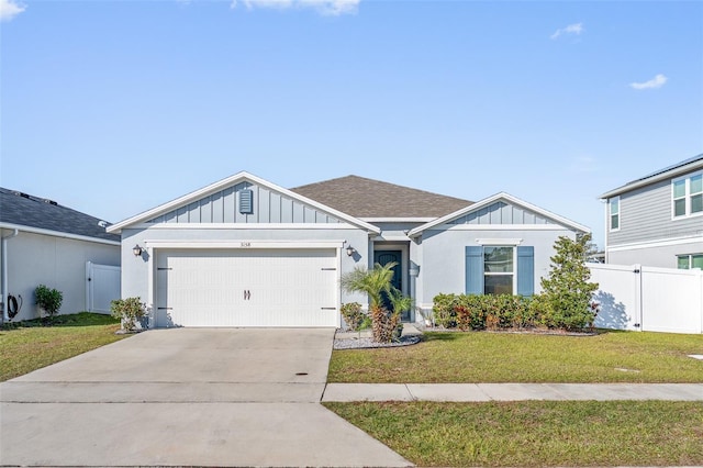 view of front of house with a garage and a front yard