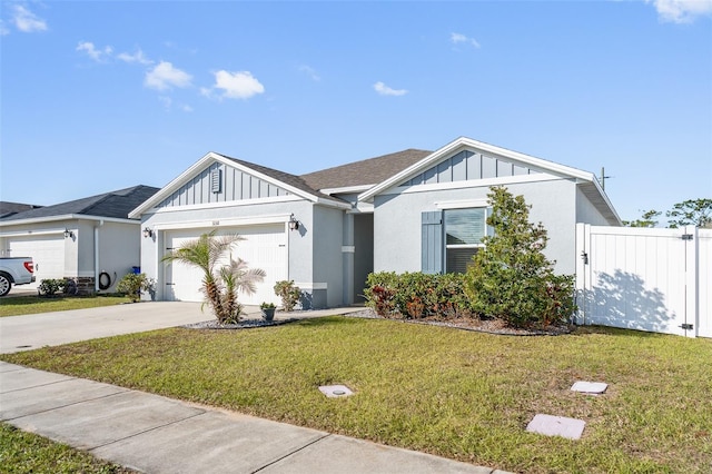 view of front of property with a garage and a front yard