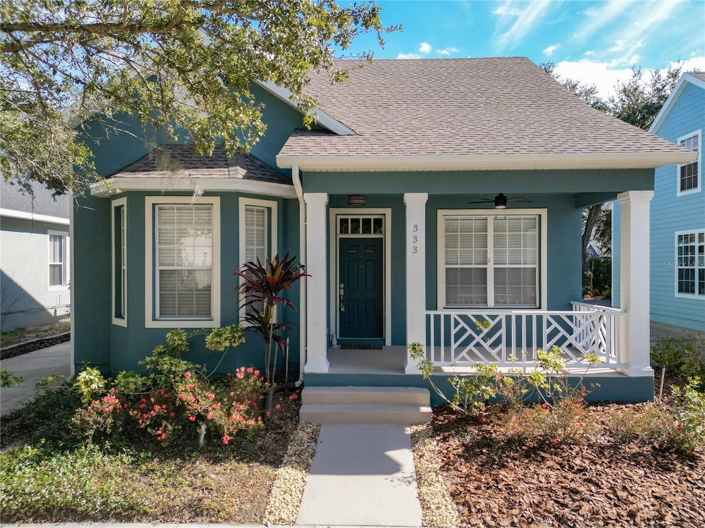 bungalow-style house with ceiling fan and a porch