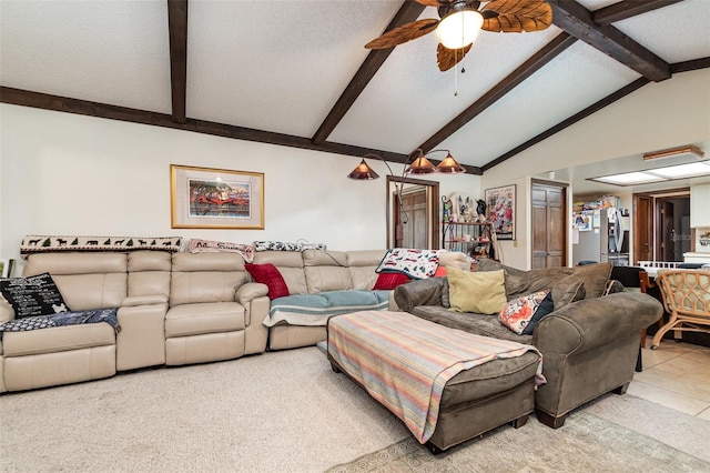 tiled living room with ceiling fan, lofted ceiling with beams, and a textured ceiling