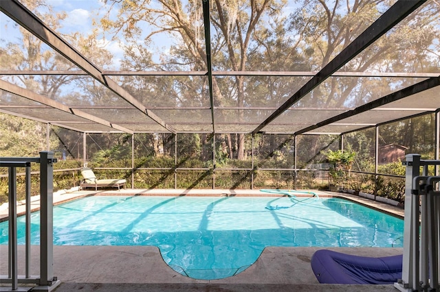 view of swimming pool with a lanai