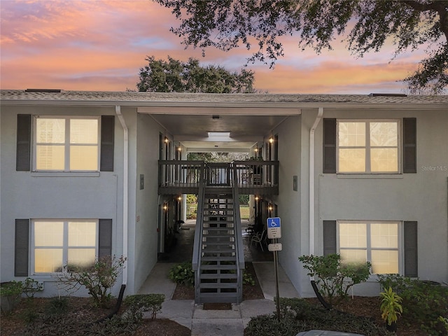 view of exterior entry at dusk