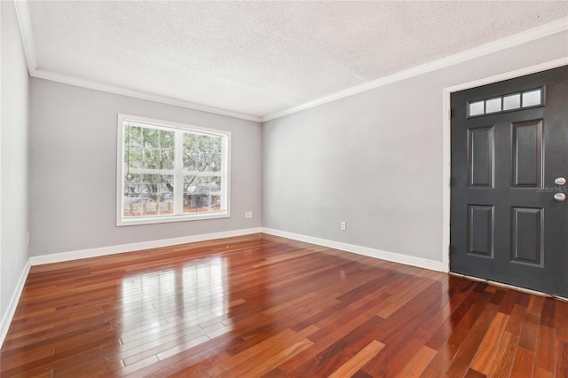 entryway featuring crown molding, dark hardwood / wood-style floors, and a textured ceiling