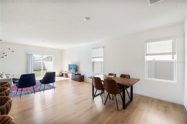 dining room featuring light hardwood / wood-style floors