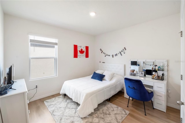 bedroom with light hardwood / wood-style flooring