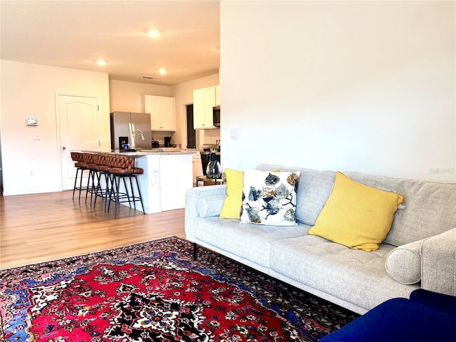 living room with light hardwood / wood-style floors