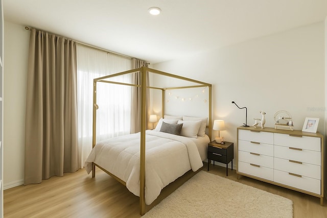 bedroom featuring light wood-style flooring