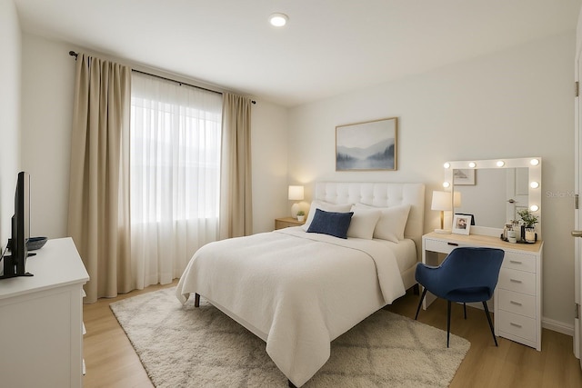 bedroom featuring light wood-style floors