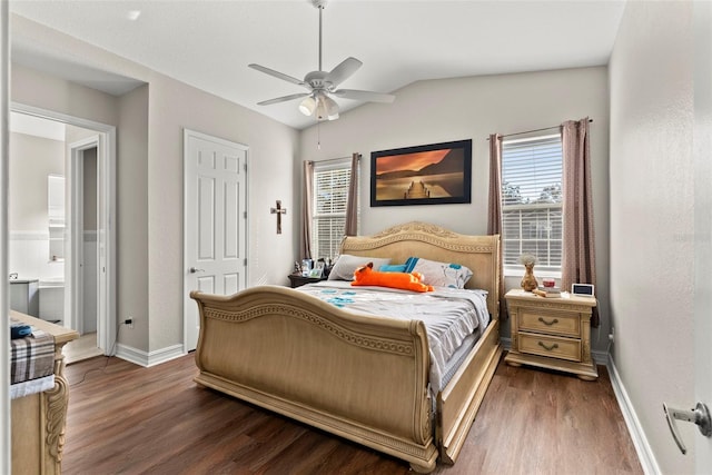 bedroom featuring multiple windows, lofted ceiling, and dark hardwood / wood-style floors