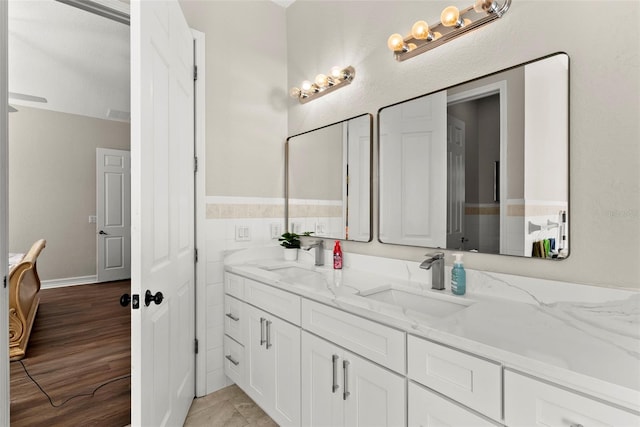 bathroom with vanity and hardwood / wood-style flooring