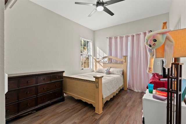 bedroom featuring dark wood-type flooring and ceiling fan