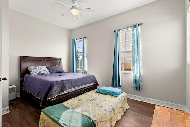 bedroom featuring dark wood-type flooring and ceiling fan