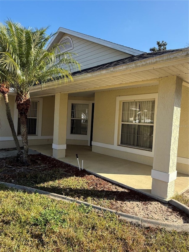 doorway to property with a patio area