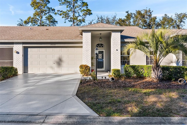 ranch-style house featuring a garage