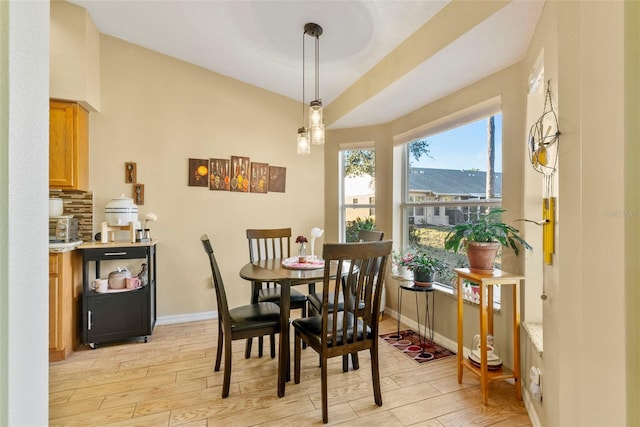 dining area featuring light wood-type flooring