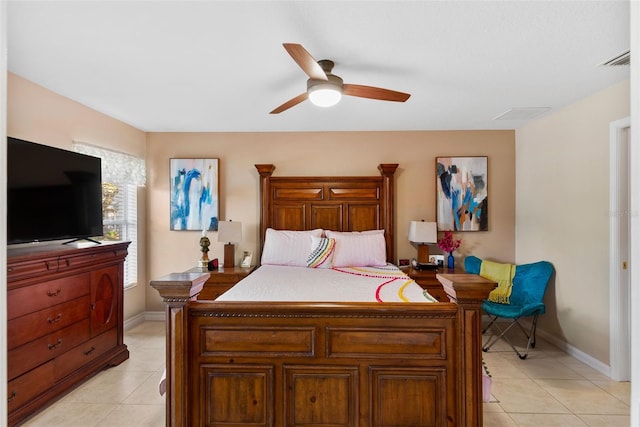 bedroom with ceiling fan and light tile patterned floors