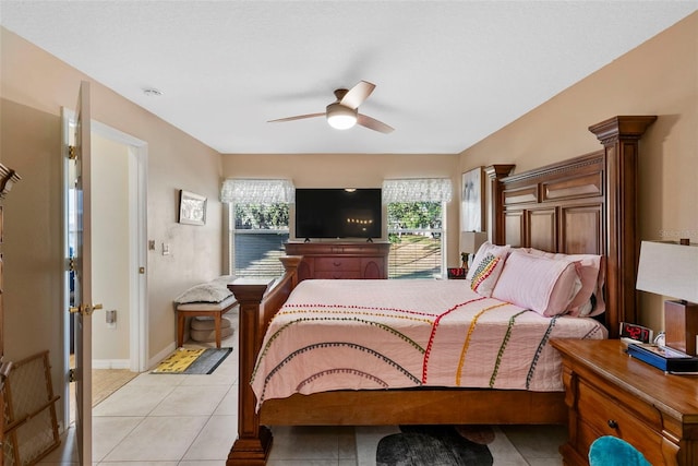 tiled bedroom with ceiling fan