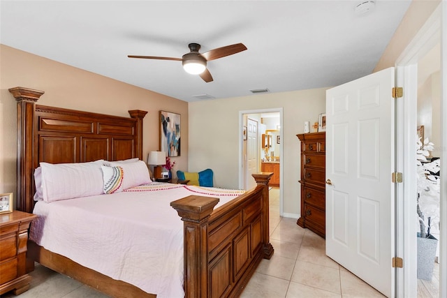 tiled bedroom with ceiling fan and ensuite bathroom