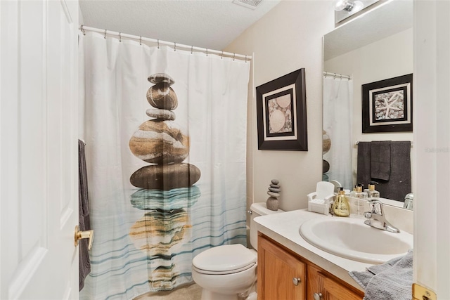 bathroom with vanity, curtained shower, and toilet