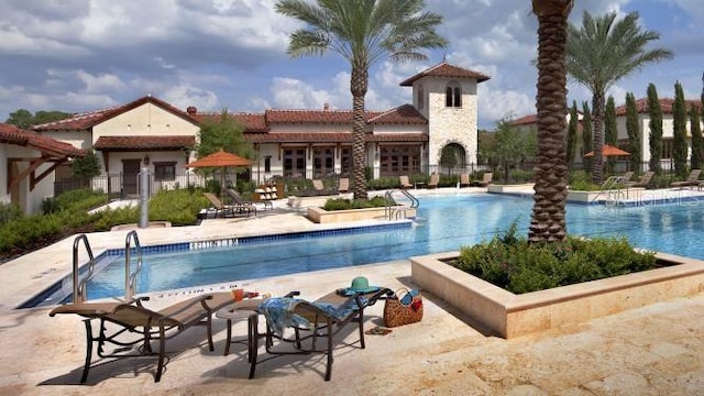 10601 Autumn Mist Ln Unit 302, Golden Oak, FL 32836 - pool featuring a patio area and fence