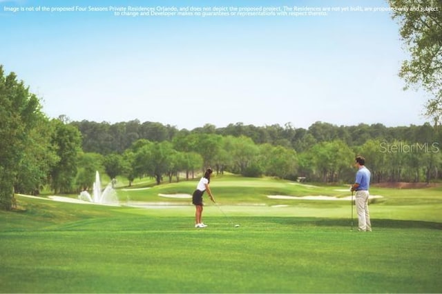 10601 Autumn Mist Ln Unit 302, Golden Oak, FL 32836 - view of property's community with view of golf course and a lawn