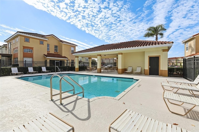 view of pool featuring a patio