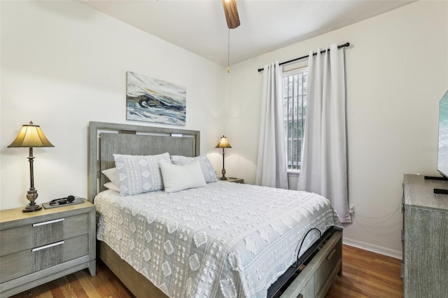 bedroom with ceiling fan and dark hardwood / wood-style flooring