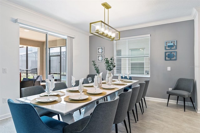 dining room with an inviting chandelier and crown molding