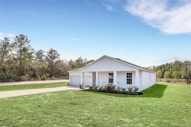 view of front of home featuring a garage and a front yard