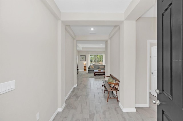 hall with light hardwood / wood-style floors