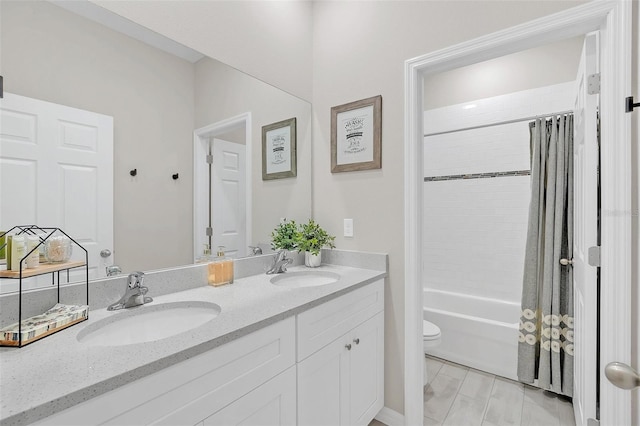 full bathroom featuring vanity, toilet, and shower / tub combo