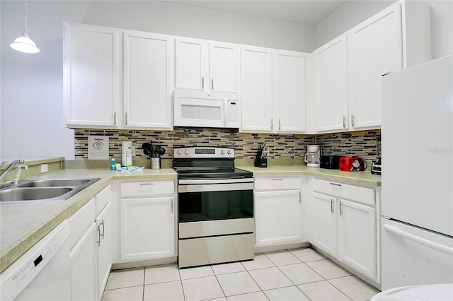 kitchen with white cabinetry, white appliances, decorative light fixtures, and sink