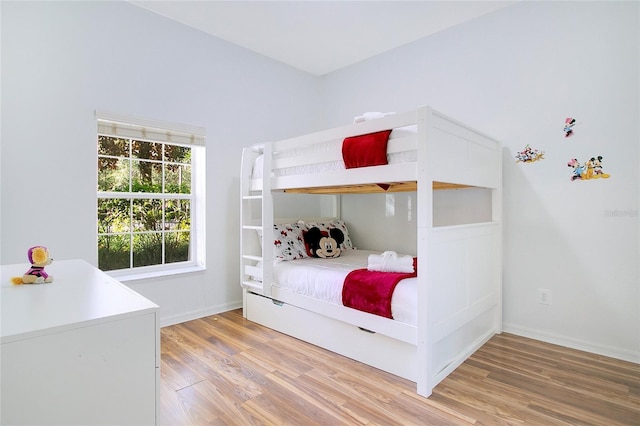 bedroom with wood-type flooring