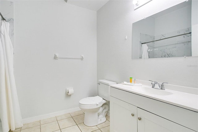 bathroom with vanity, toilet, curtained shower, and tile patterned flooring