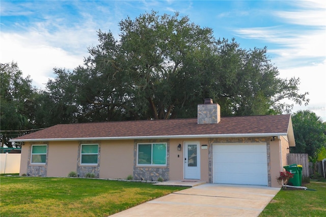 single story home featuring a garage and a front lawn