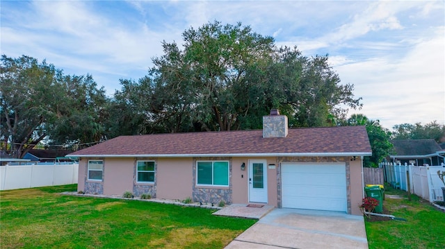 ranch-style house featuring a garage and a front lawn