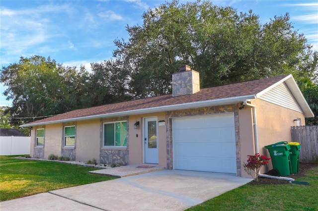 ranch-style house with a garage and a front lawn